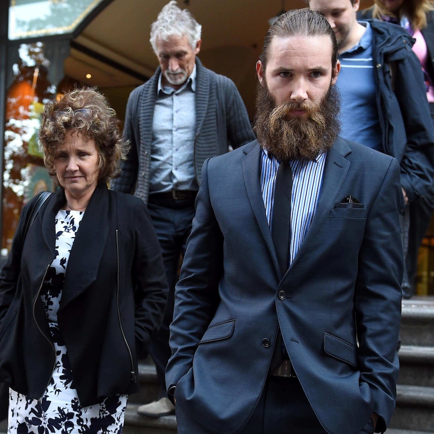 Assault victim Simon Cramp (right) and his mother Angela leave the Downing Centre District Court.