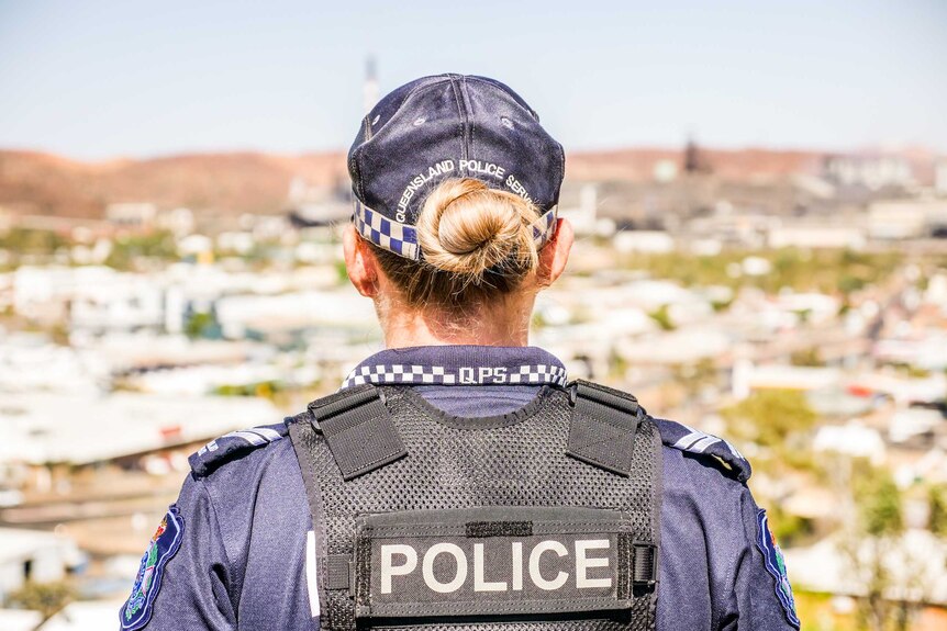 Acting Senior Constable Aimee Sewell looks out over the town on a bright sunny day.