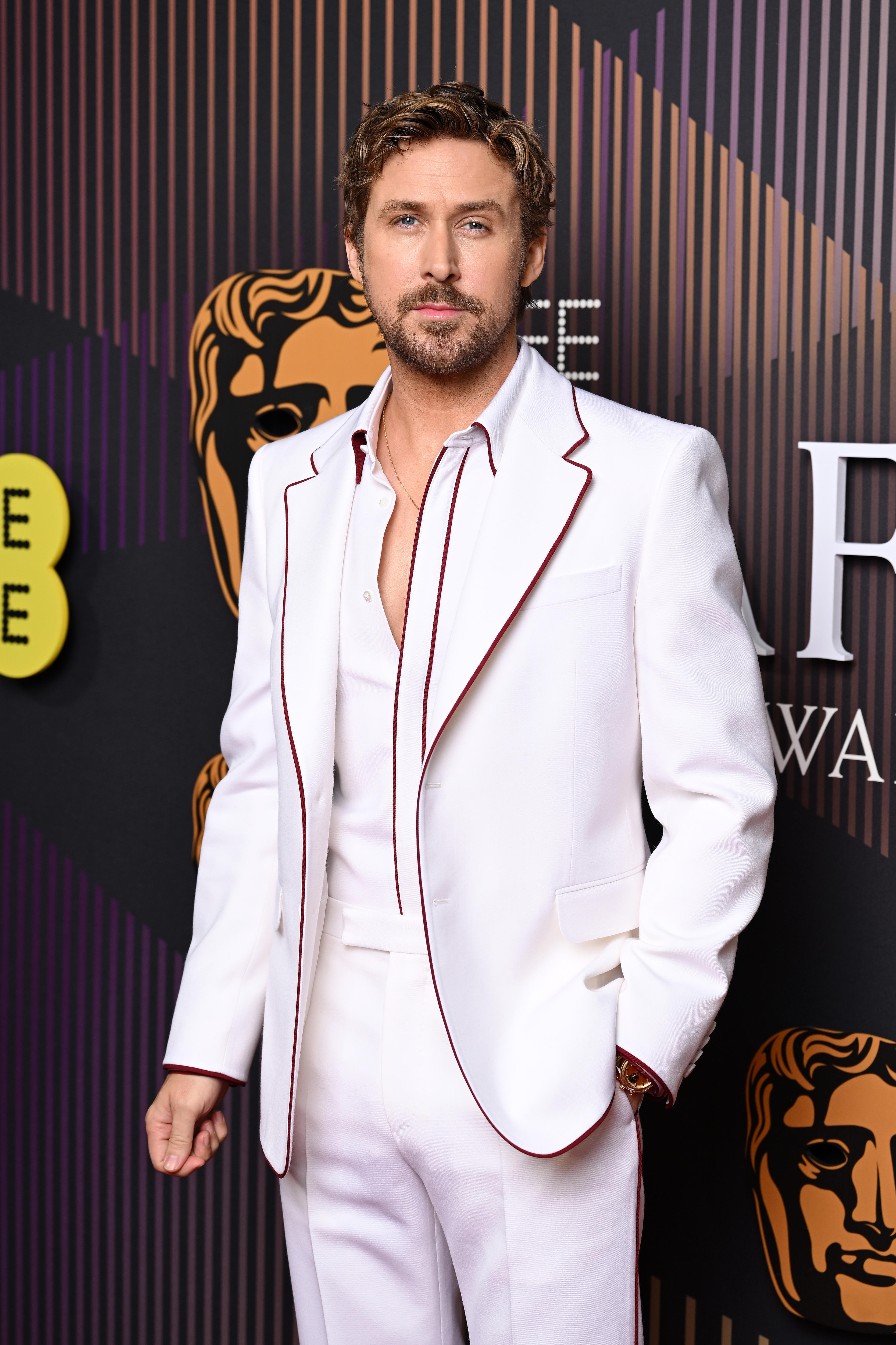 Ryan Gosling on the red carpet wearing an all white suit