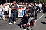 Protesters march through South Brisbane after the Aboriginal tent embassy was dismantled.