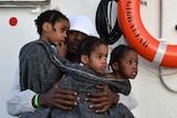 A migrant family rescued off the Libyan coast