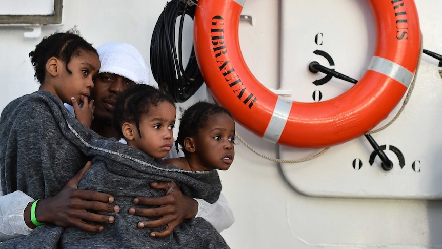 A migrant family rescued off the Libyan coast