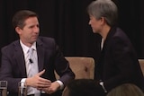 Simon Birmingham holds out his hand as Penny Wong looks at him refusing to shake it