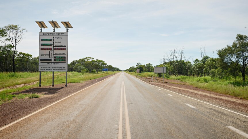 An outback highway with sign 