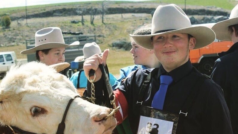 Yass school student Zeke Groom with bull at cattle showing.