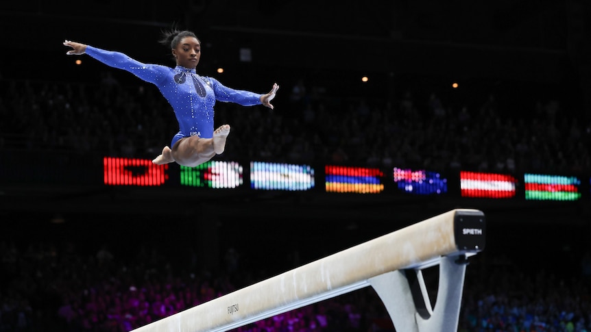 Simone Biles competes on the beam during the women's all-round final 