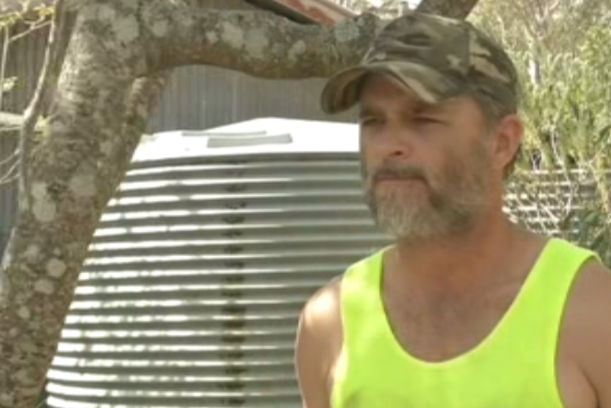 Brett Dreyer stands outside his rural property in the Darling Downs.