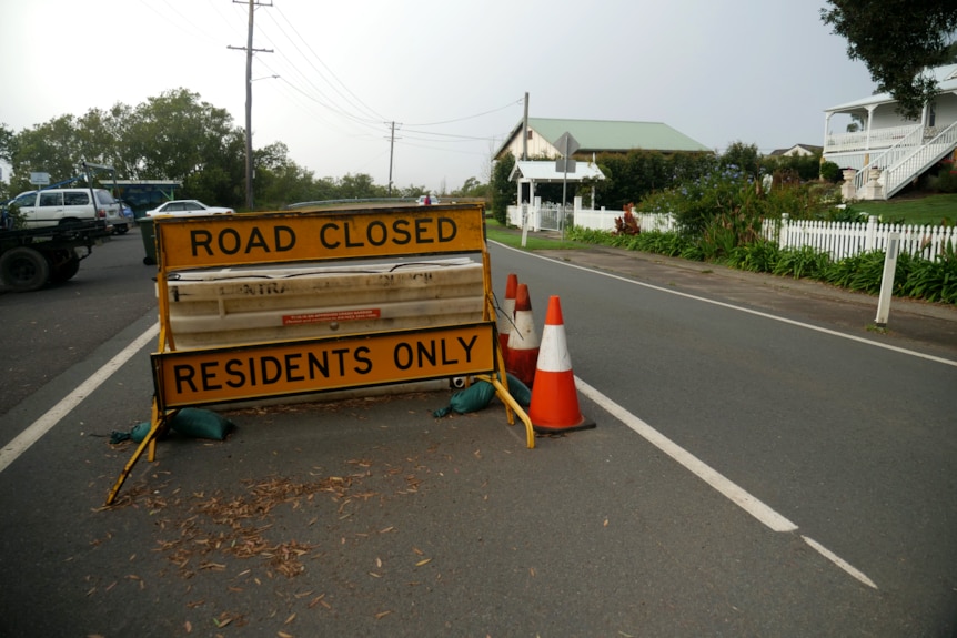 A sign on the road that reads Road Closed Residents Only