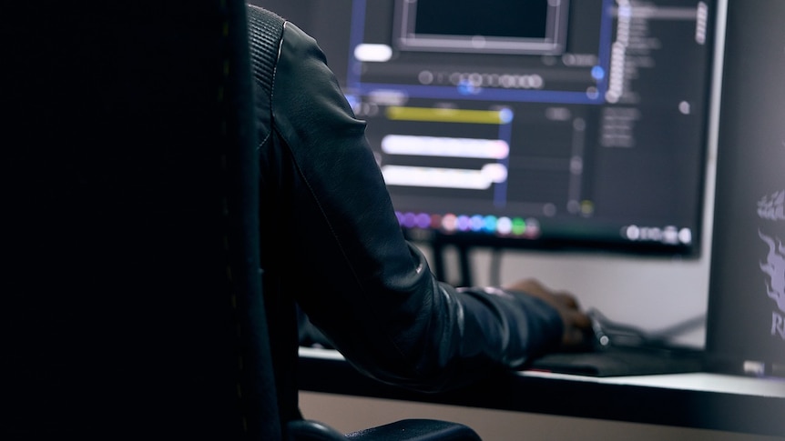 a man sitting at a computer