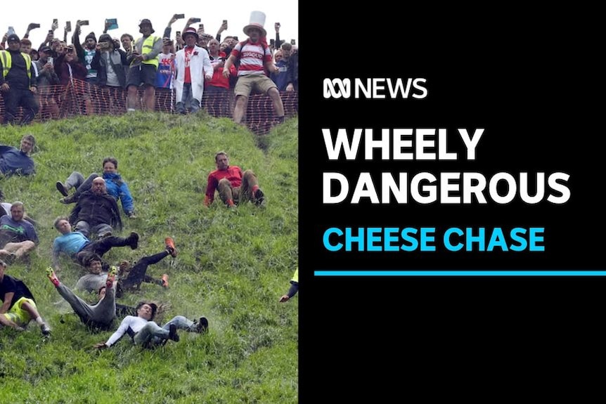Wheely Dangerous, Cheese Chase: A group of men seen rolling down a hill as a large group watches