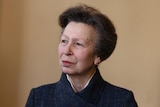 A portrait of Princess Anne looking off to her right with a small smile.