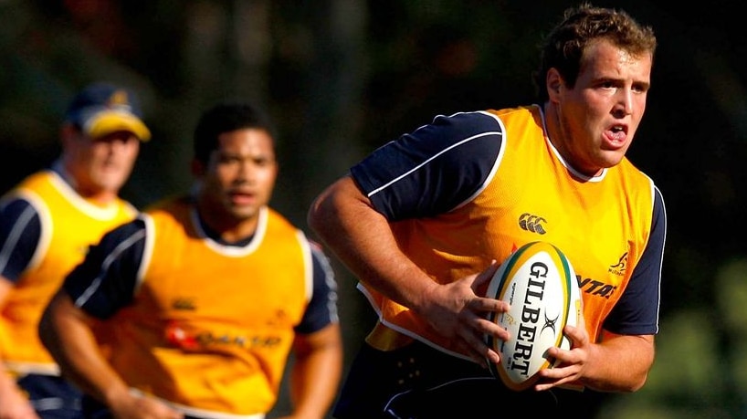 Wallabies player Ben Alexander runs the ball