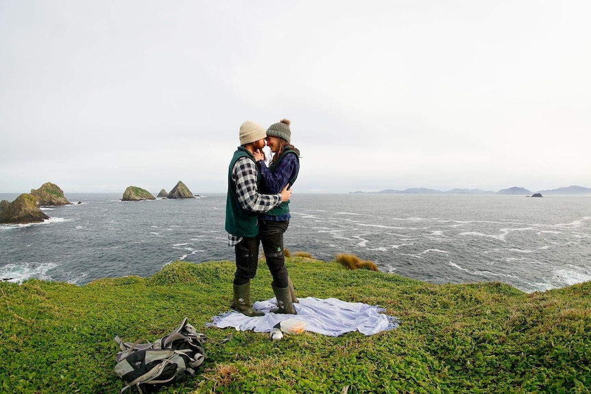 Hannah Sutton and Grant Ryan embrace on Maatsuyker Island