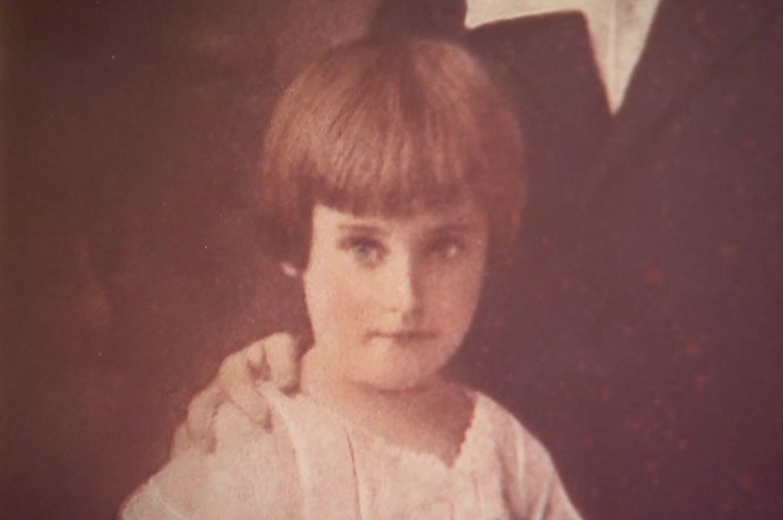 A sepia photo of a young girl