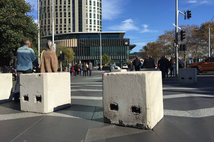 Square concrete bollards along the footpath at Southbank.