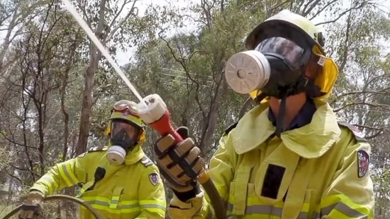 RFS firefighters battle a blaze wearing P3 masks.