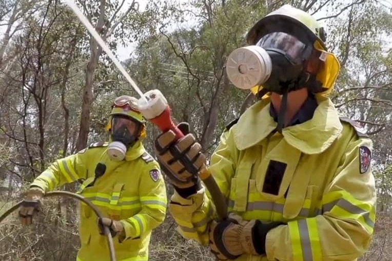 RFS firefighters battle a blaze wearing P3 masks.