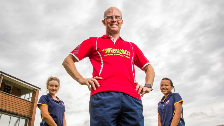 Teacher Michael Eccleston with students Courtney Peters and Tiana Stellenberg.