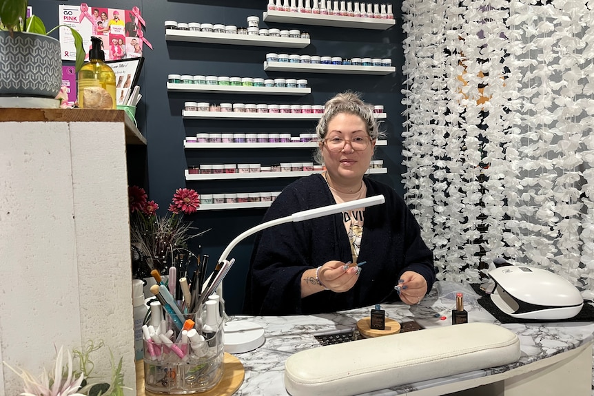 A woman sitting in a beauty salon.