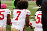San Francisco 49ers quarterback Colin Kaepernick kneels for the national anthem