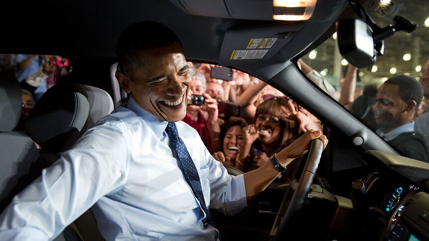 President Barack Obama gets close to Ford employees