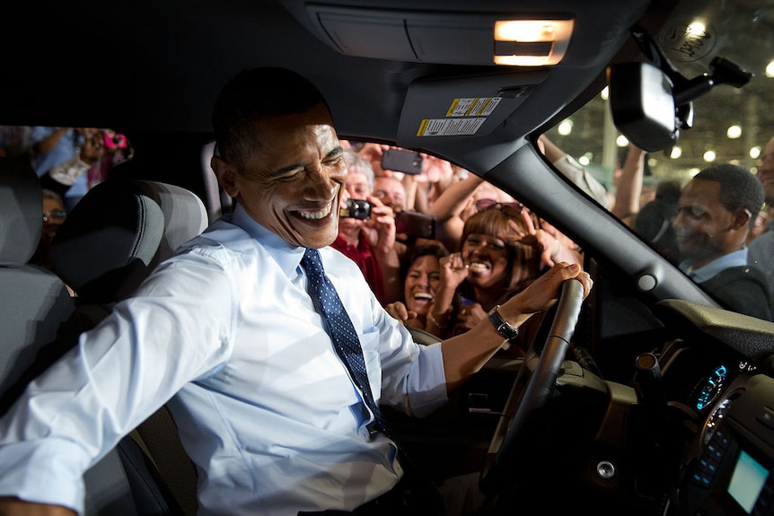 President Barack Obama gets close to Ford employees