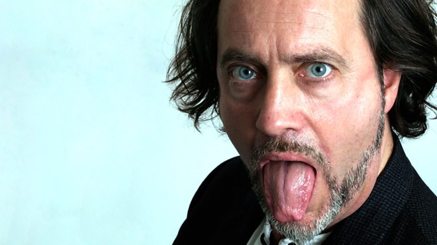 A head shot Ian Cognito with his tongue out