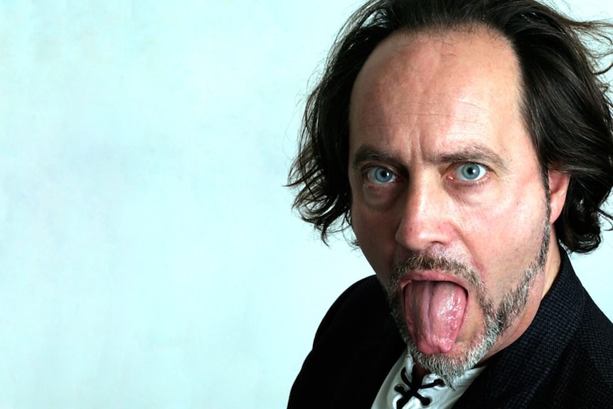 A head shot Ian Cognito with his tongue out