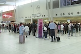 People waiting in line at an airport