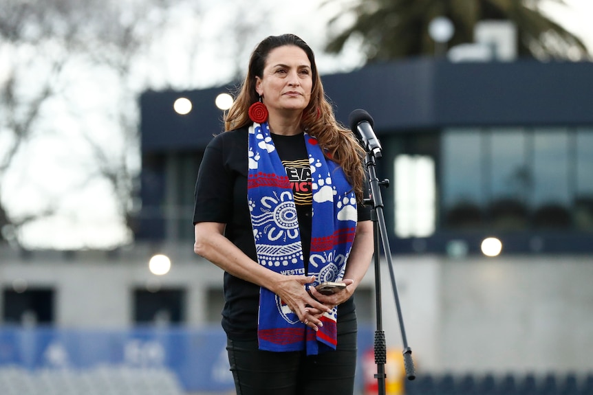 Wotjobaluk and Dja Dja Wurrung Woman Belinda Duarte performs an acknowledgement of Country in a Western Bulldogs scarf