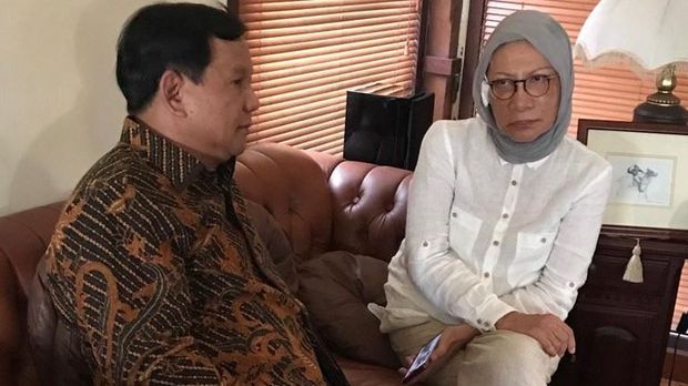 Ratna Sarumpaet sits next to Prabowo Subianto