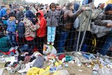 Children asylum seekers against fence