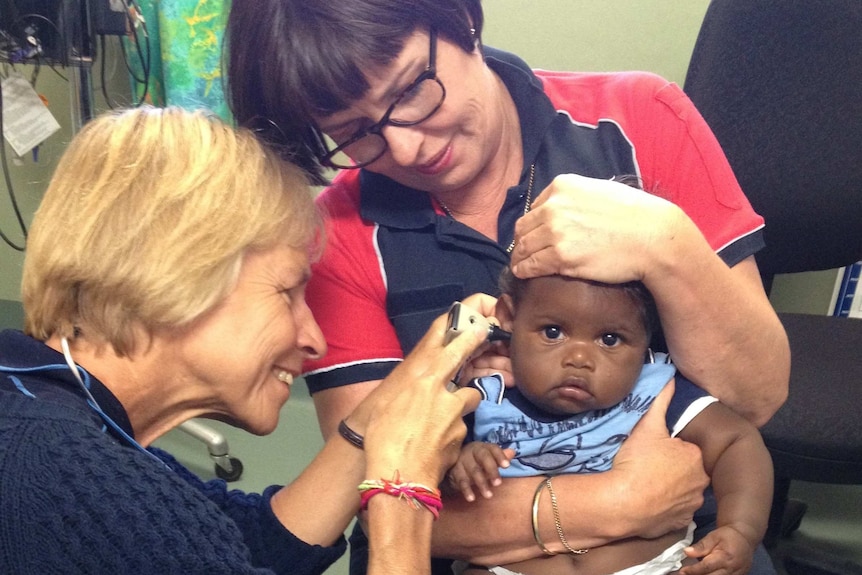 RFDS doctor examines a baby