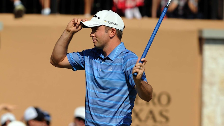 Scotland's Martin Laird sinks a birdie putt to win the Texas Open.