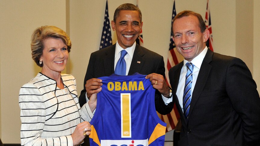 Opposition Leader Tony Abbott and his deputy Julie Bishop present US president Barack Obama with a West Coast Eagles Jersey.