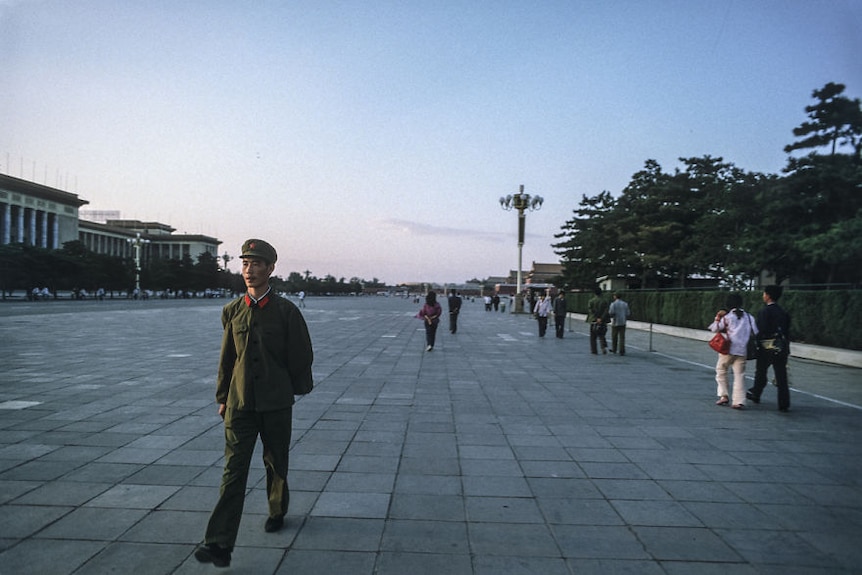 An officer walks along the west side of Tiananmen Square in 1984.