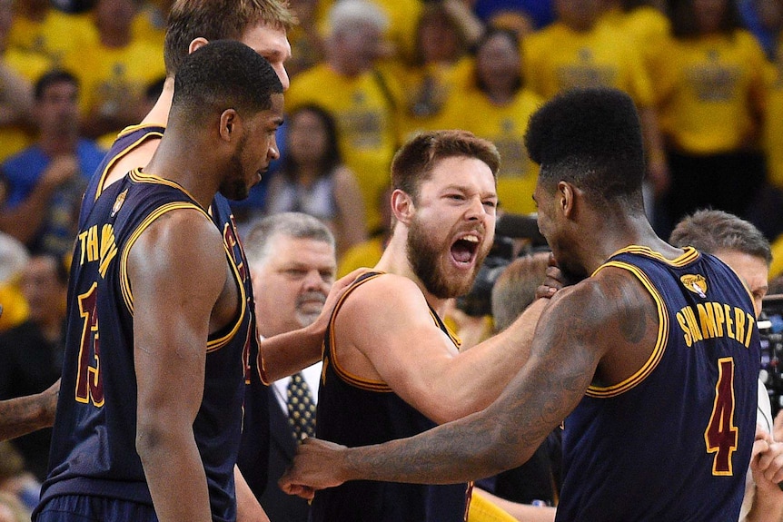 Matthew Dellavedova celebrates a Cavs win over the Warriors