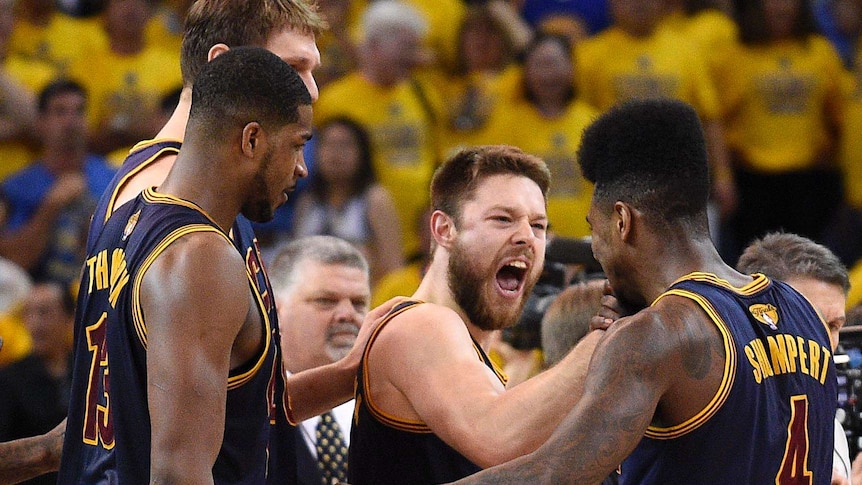 Matthew Dellavedova celebrates a Cavs win over the Warriors