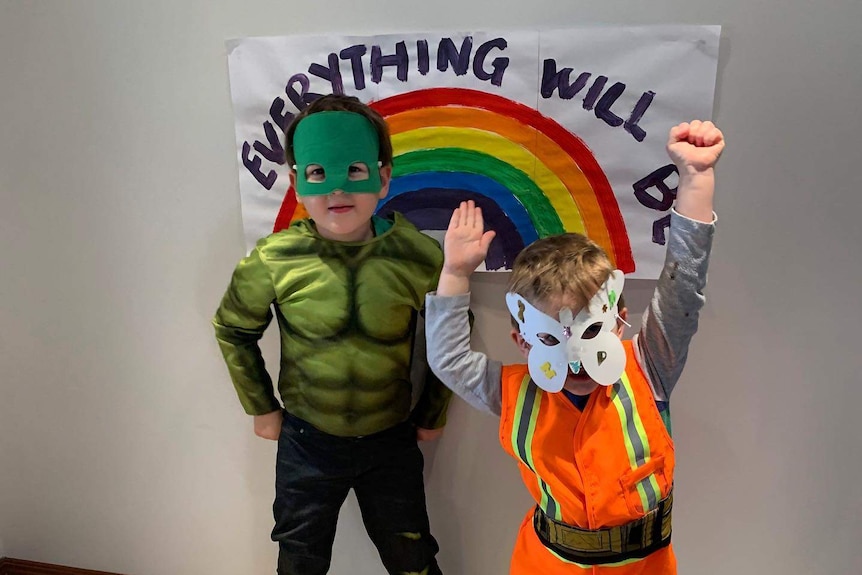 two kids dressed as superheros