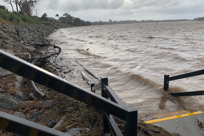 Water laps at the banks of the swollen Shoalhaven River 