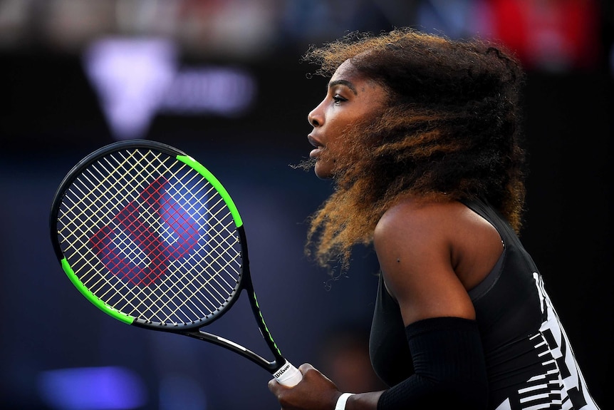 Serena Williams waits for a serve from her sister Venus during the Australian Open final.