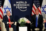 US President Donald Trump, right, sits next to Israeli Prime Minister Benjamin Netanyahu at the World Economic Forum.