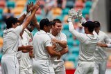 Doug Bracewell surrounded by NZ team-mates in Hobart