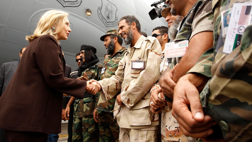 Hillary Clinton greets soldiers in Tripoli