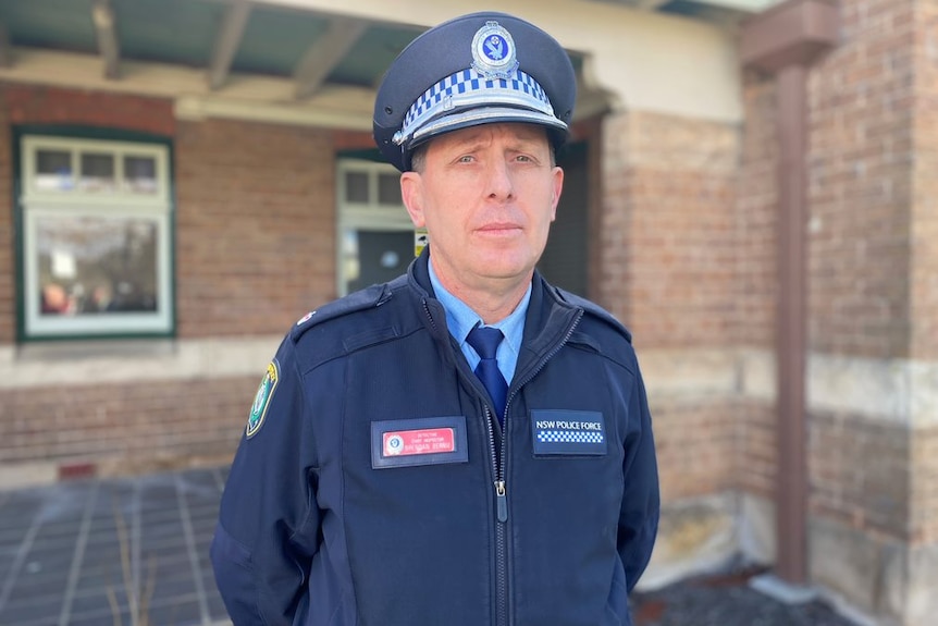 A male police officer in uniform.
