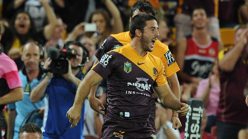 Brisbane's Ben Hunt celebrates a try against the Sydney Roosters at Lang Park on March 21, 2014.
