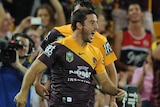 Brisbane's Ben Hunt celebrates a try against the Sydney Roosters at Lang Park on March 21, 2014.