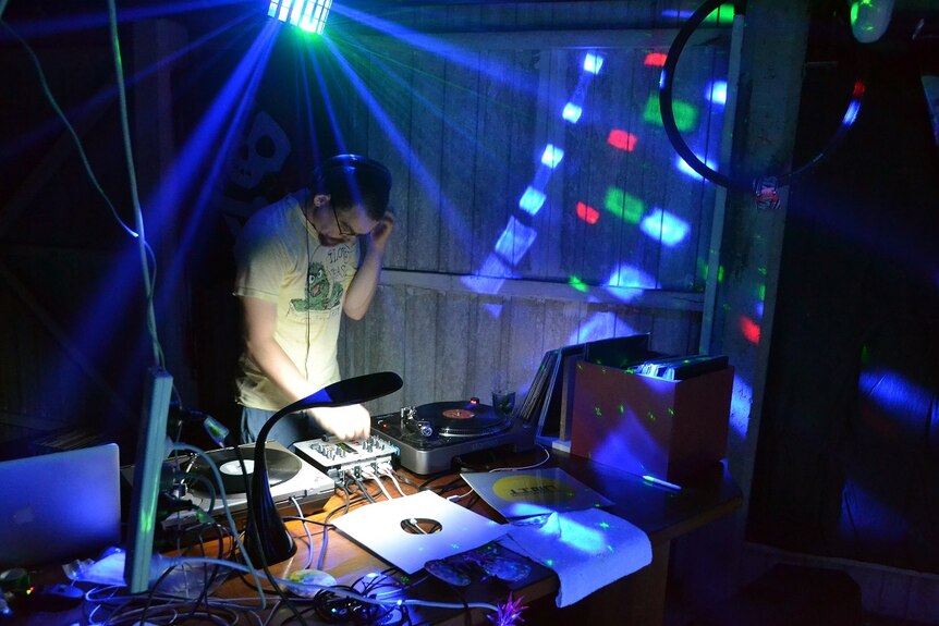 Julian Scharf DJs at his party.