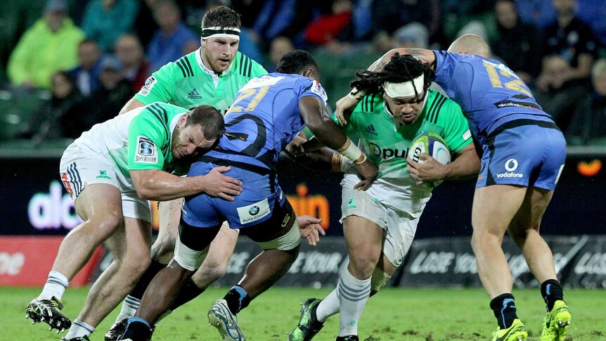 Aki Seiuli of the Highlanders looks to break through the Western Force's defence.