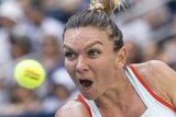 Simona Halep winds up to hit a two-handed backhand at the US Open.